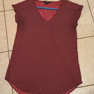 Red and white polka dot v neck blouse